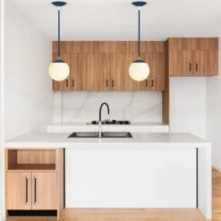 Color Cap Pendant 8" -Cozy Light World cap pendant 8 persona pulls nickel cobalt kitchen scene dutton brown photo by r architecture unsplash 1 square